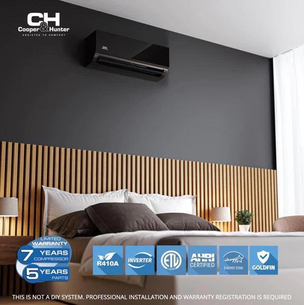 Bedroom with a Cooper & Hunter air conditioner, wooden headboard, and gray wall.
